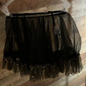 Curtain Call Costumes black shiffon skirt with yellow gold ruffled bottom.